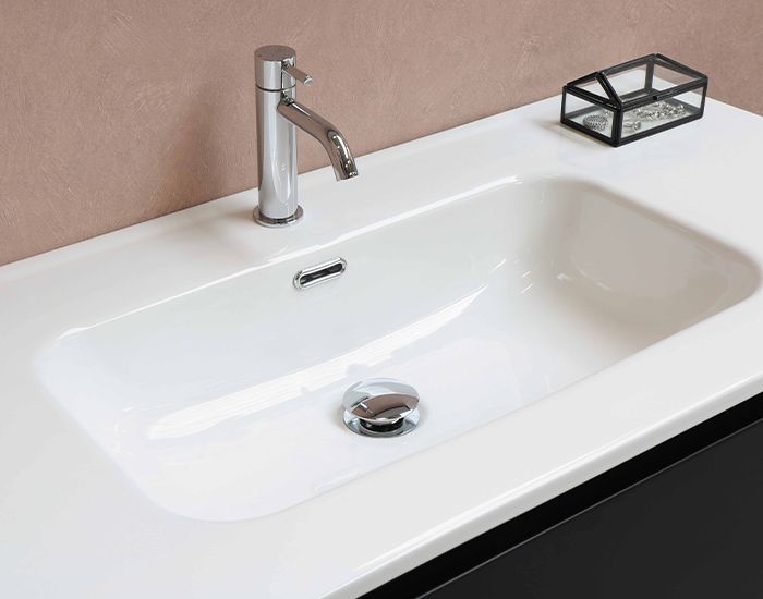 White bathroom sink that has been reglazed