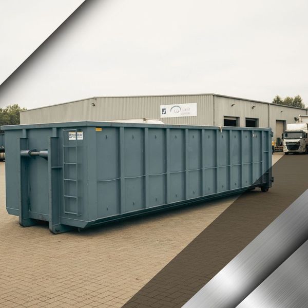 A large, empty roll-off container placed at a commercial business, ready for scrap metal collection. Steel and Iron Recycling 4.jpg