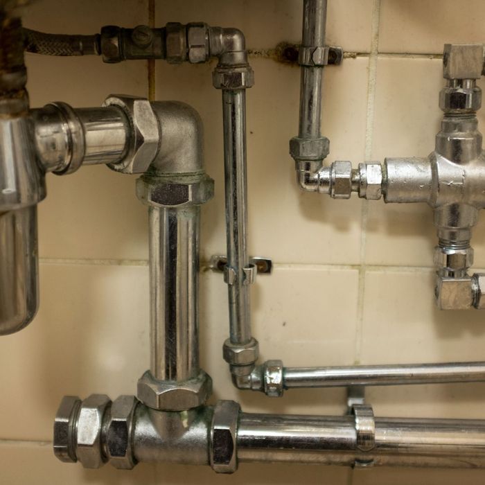 pipes  on tiled wall