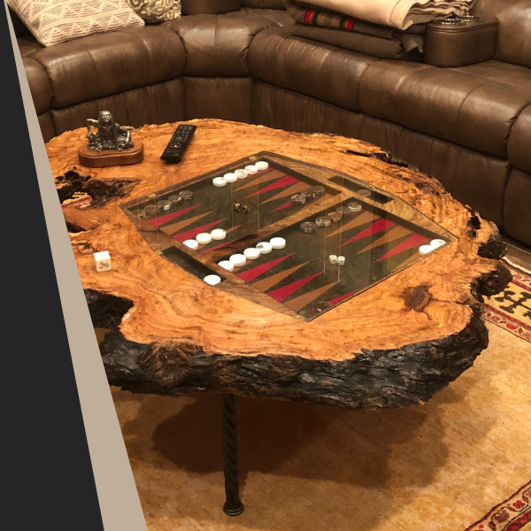 Backgammon board built into a dark wood table