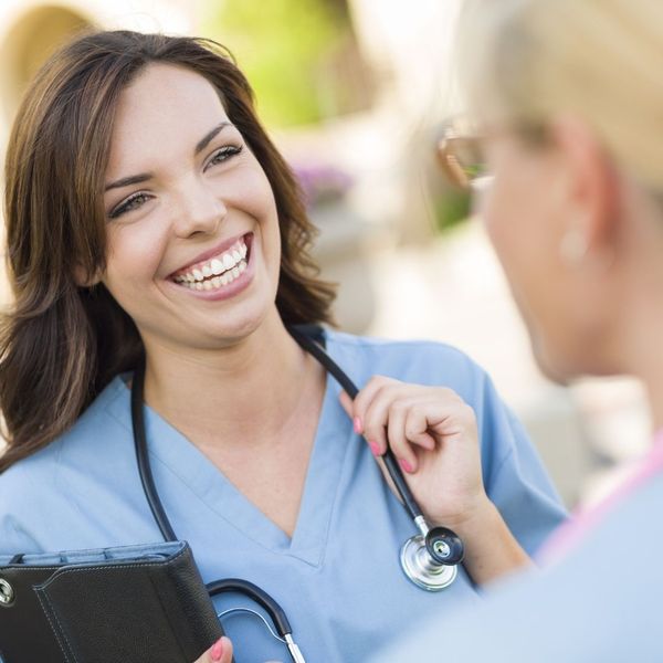 A nurse and a young woman. A nurse and a young woman.