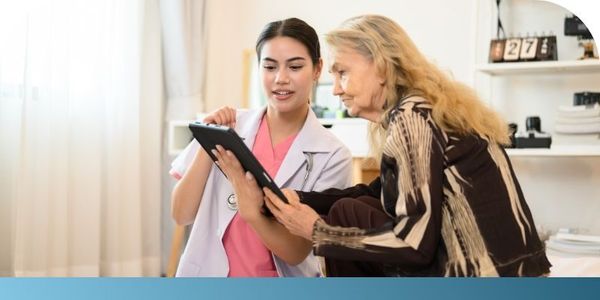 nurse talking to a senior resident about ultrasound scans