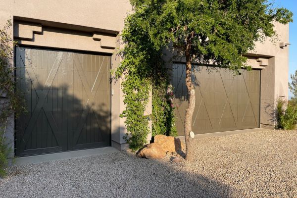 garage doors on stucco house Roller track repair 2.jpg