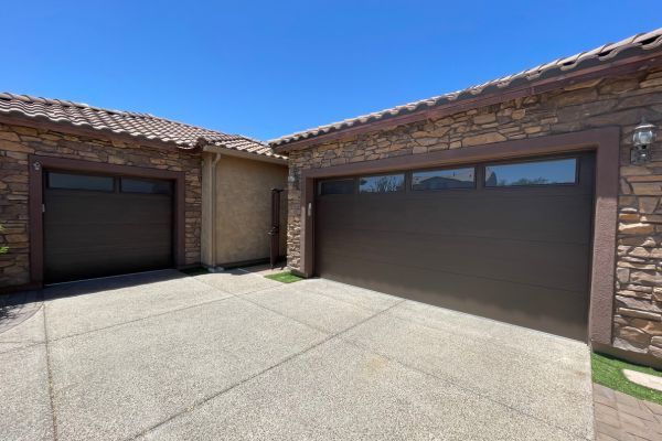 garage doors with stone and stucco exterior Garage Door Opener Repair 2.jpg