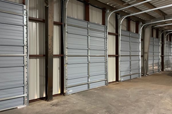 inside of garage with multiple doors Garage Door Opener Repair 4.jpg