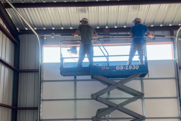 service technicians on lift Spring Replacement 1.jpg