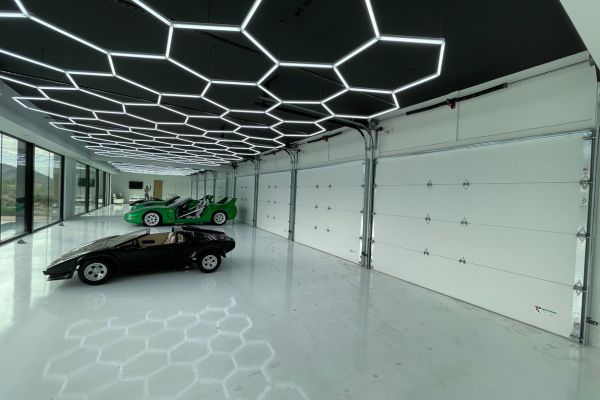 inside garage with sports cars and glass windows Panel Replacement 2.jpg