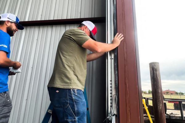 technician works on garage door track Arizona Garage Door Services 2.jpg