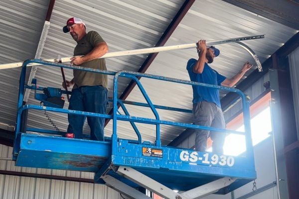 workers on scissor lift Arizona Garage Door Services 4.jpg