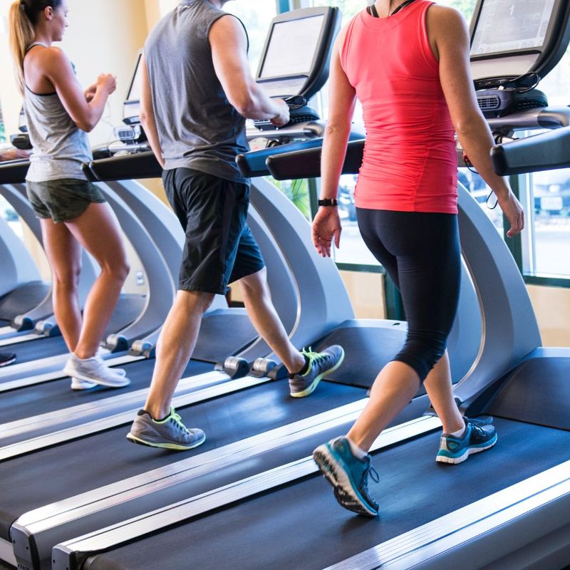 people walking on treadmills