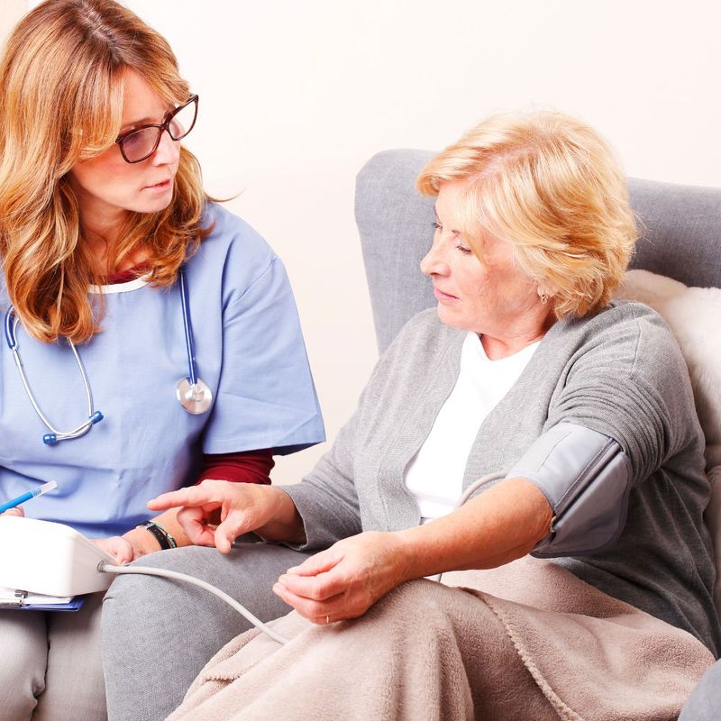 woman testing blood pressure