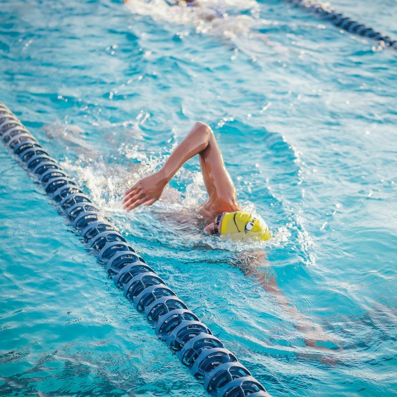 a person swimming laps in a pool