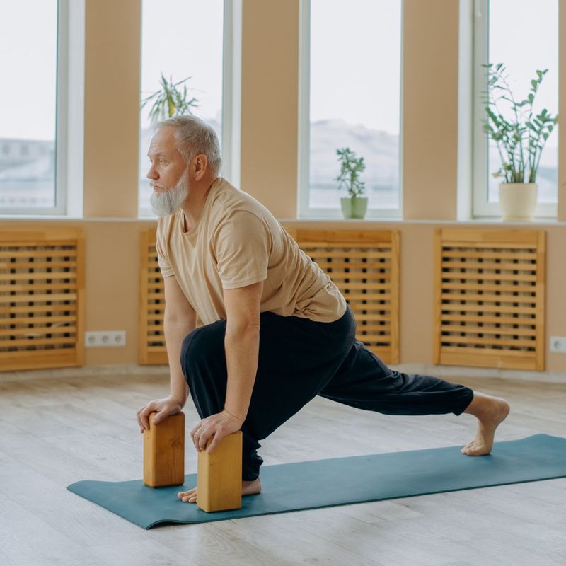 older man doing yoga