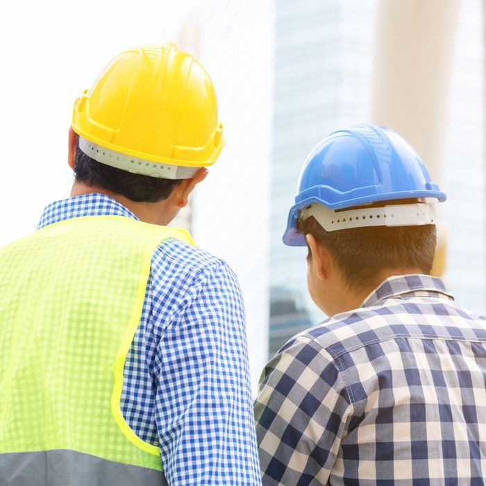 construction workers standing together construction workers standing together