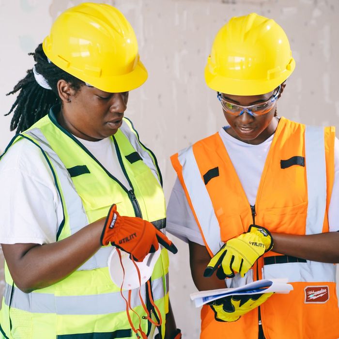 construction workers looking at documents