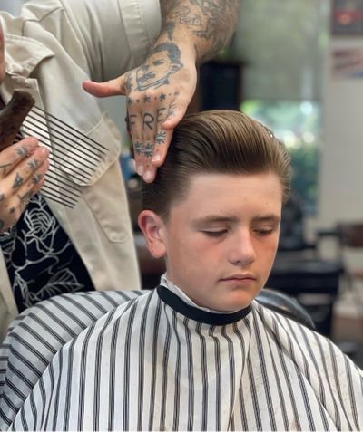 Professional barber cutting hair in Eagle Idaho