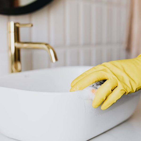 an apartment sink being deep cleaned an apartment sink being deep cleaned