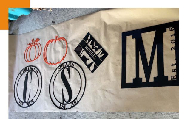 custom metal signs laying out