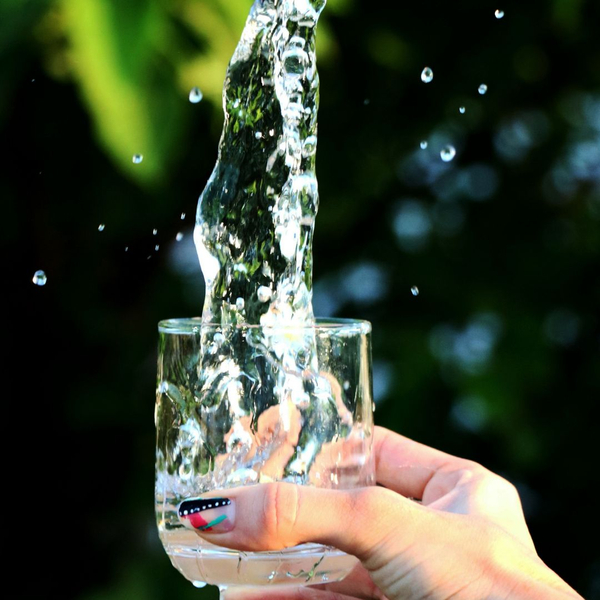 Water falling into glass