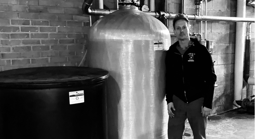 man stands next to equipment