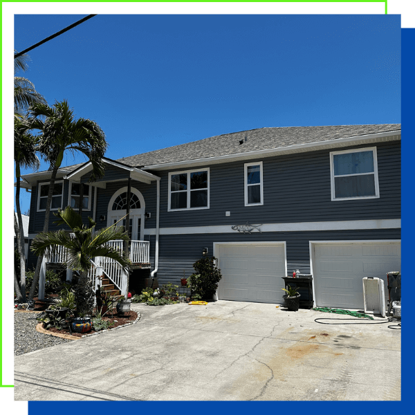 house with two-car garage and new siding