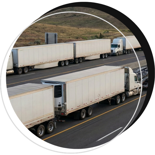 Long line of trailers moving in sequence on a highway corridor