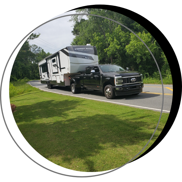 Black truck with a mobile home Black truck with a mobile home