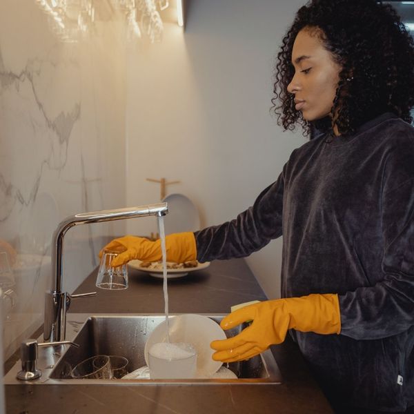 woman washing dishes woman washing dishes