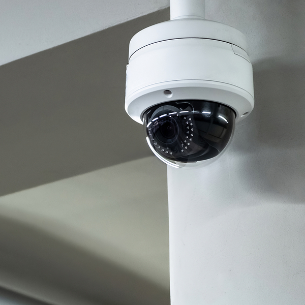 A high-tech security camera is shown mounted on a wall, highlighting the importance of surveillance. securitycamera.jpg