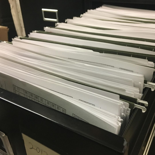filing cabinet drawer full of papers