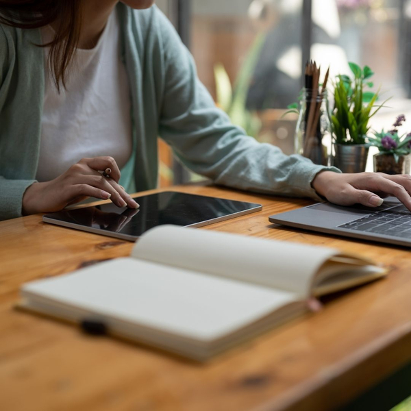woman making detailed list on computer 