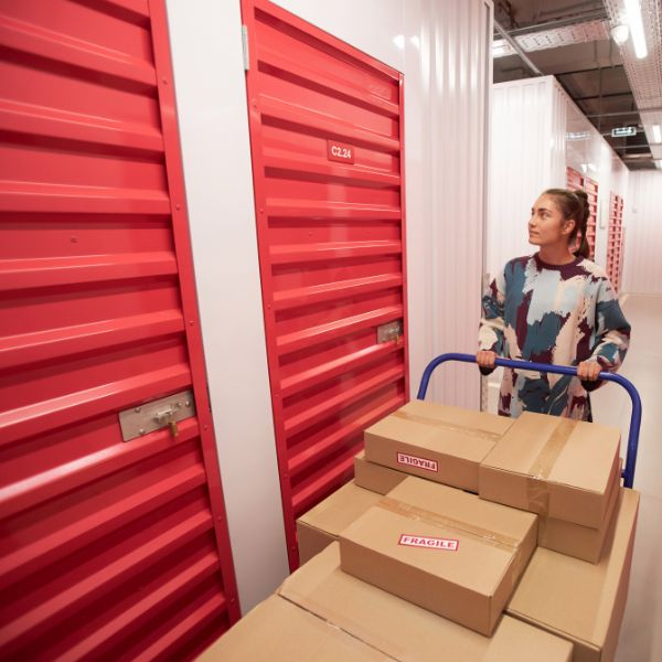 woman with boxes looking for storage unit