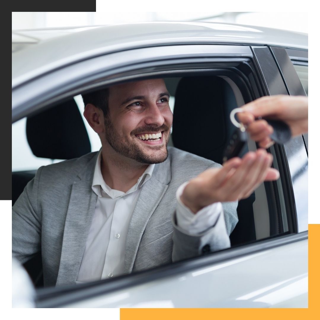 seller handing car keys over to buyer