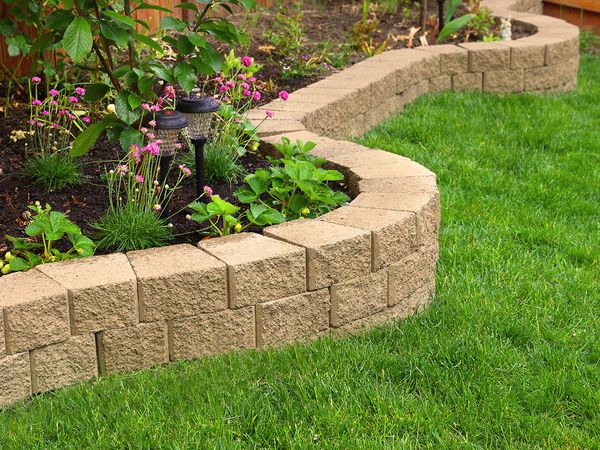 Stone wall with perfect grass landscaping