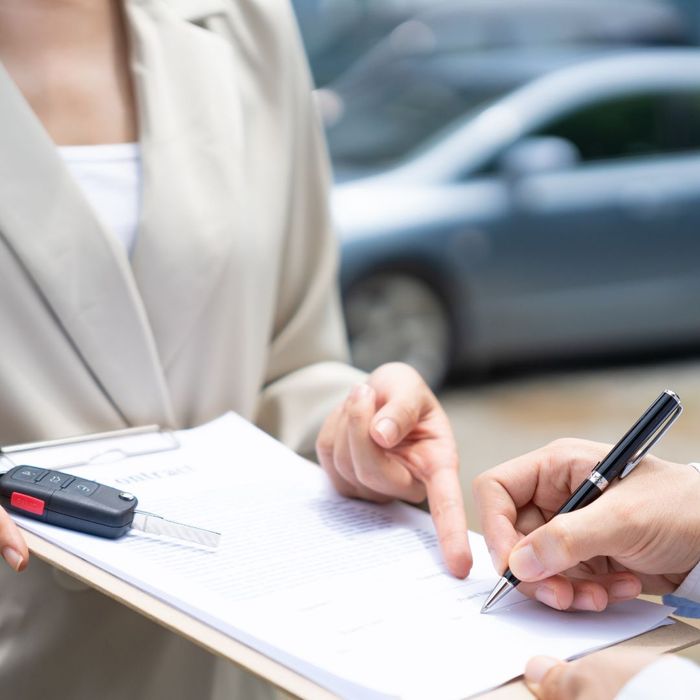 signing lease agreement in parking lot
