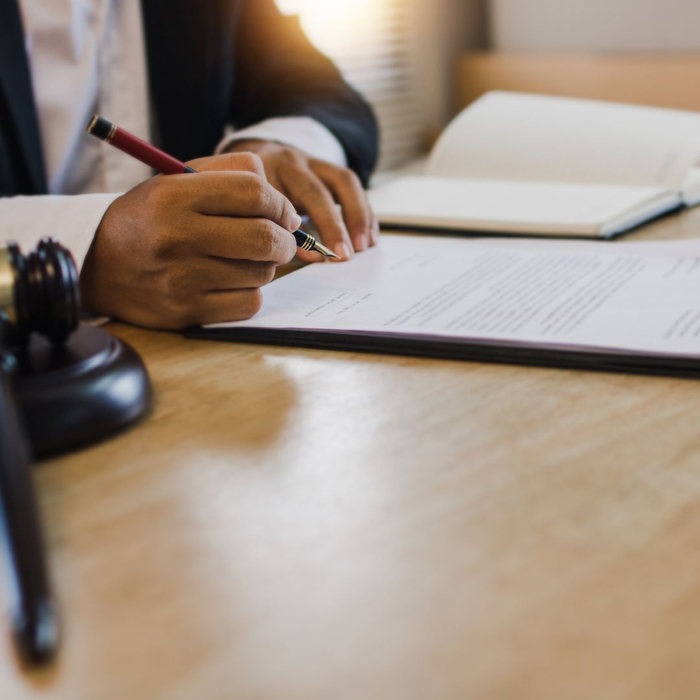 lawyer signing documents