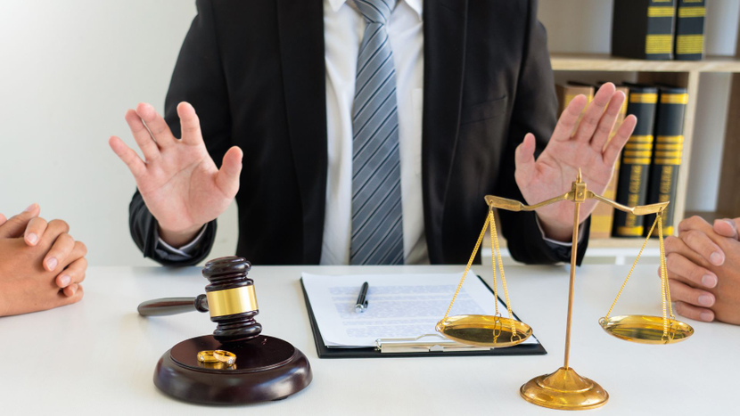 A lawyers desk with a gavel and scales