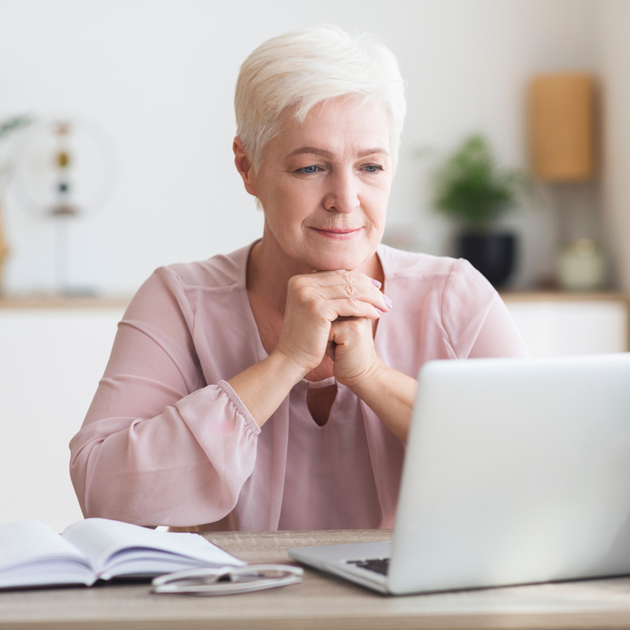 woman looking at a computer screen.