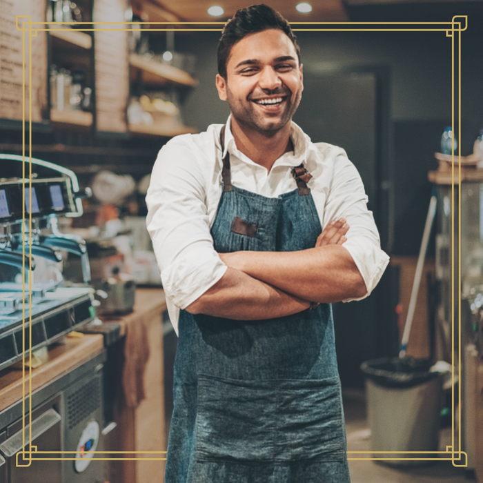 Smiling cafe owner