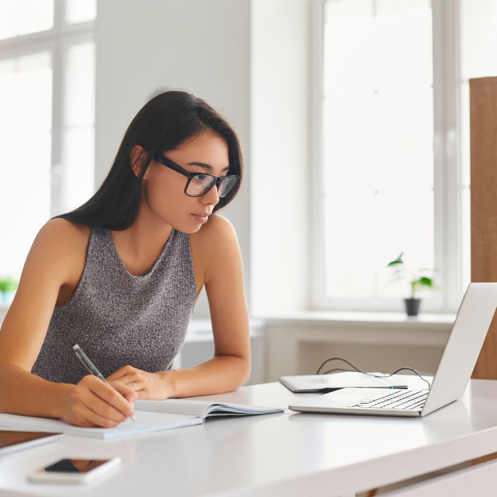 woman researching on computer