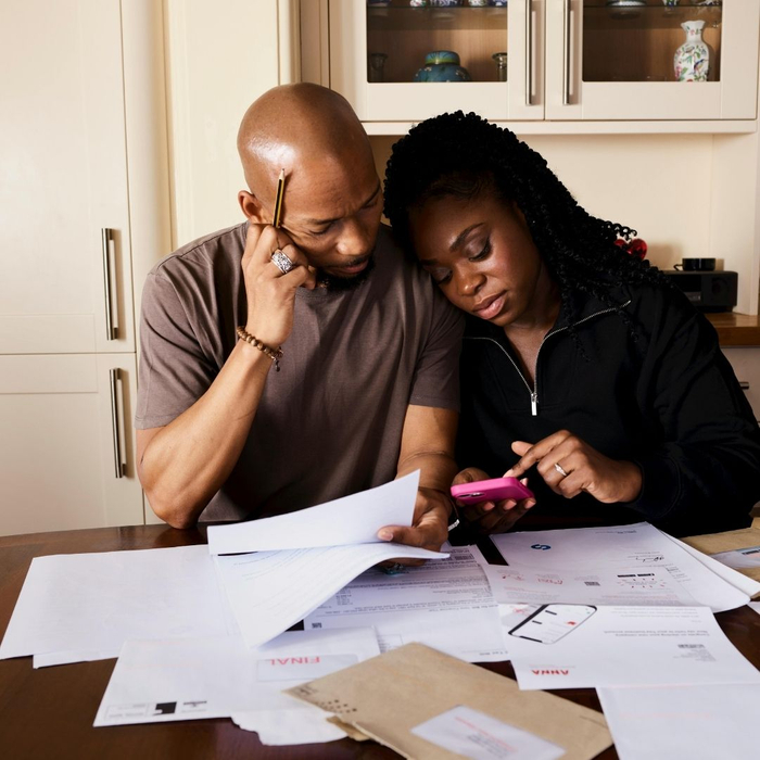 couple looking at final notice bills