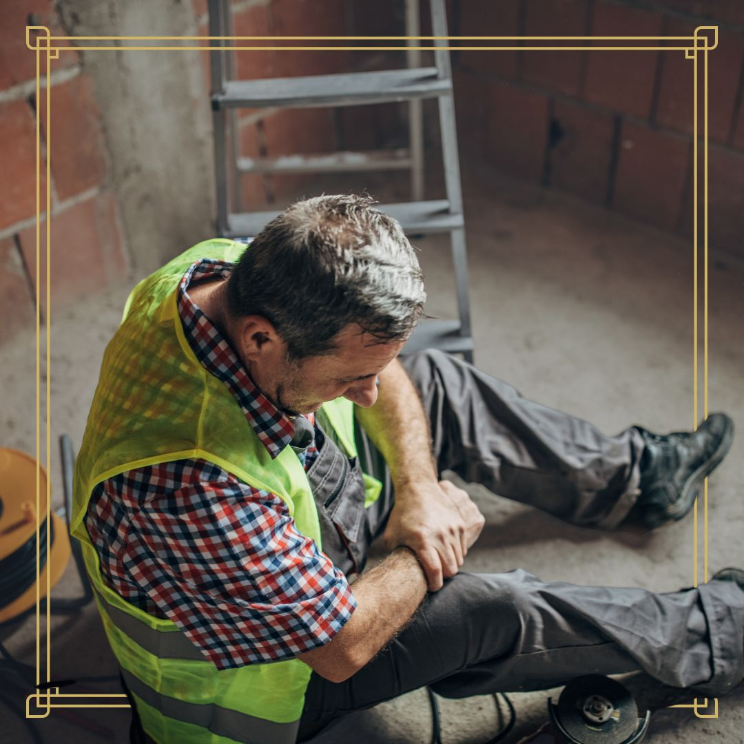 Injured worker grasping their arm