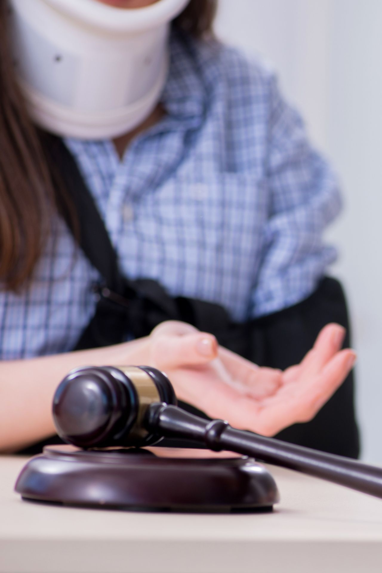 a gavel with an injured person talking in the background