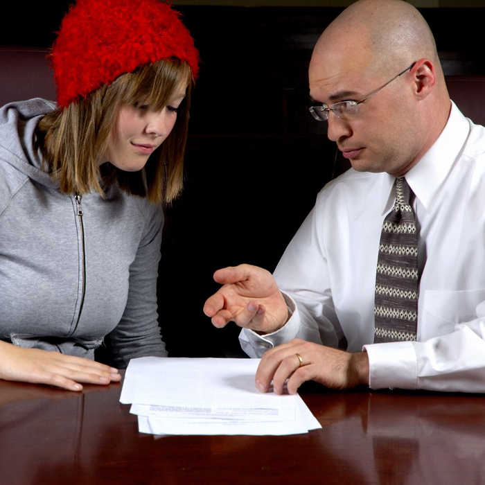 lawyer explaining paperwork to client