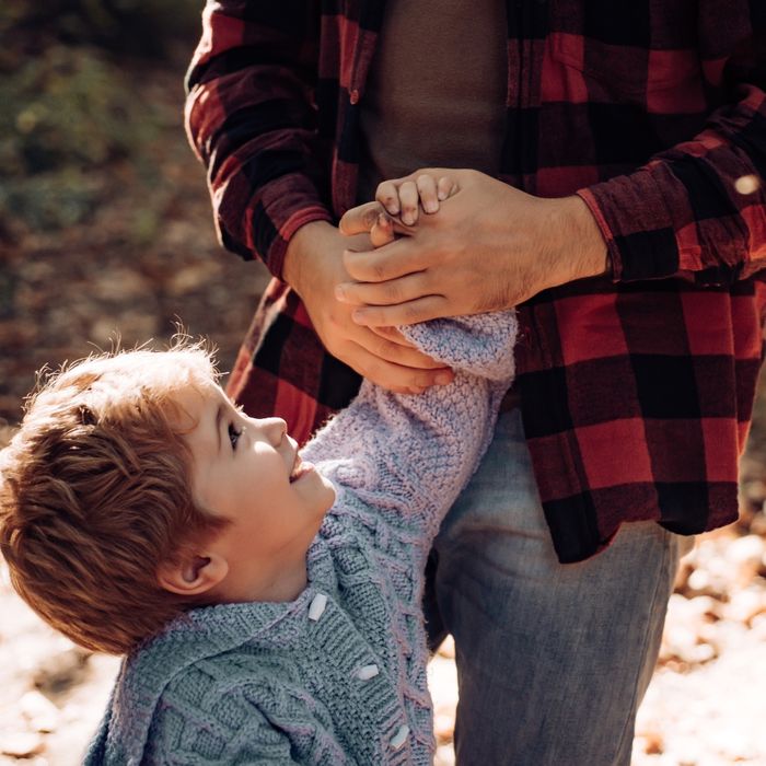 Father holding a child's hand