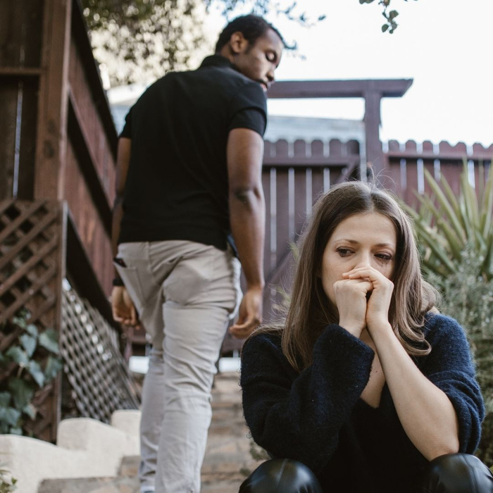 man walking past wife who is crying 