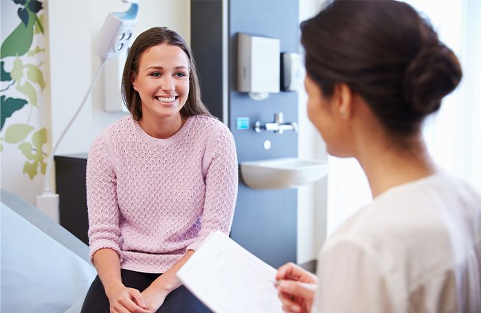 woman speaking with provider