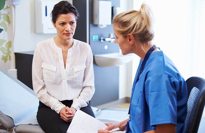 woman speaking with provider