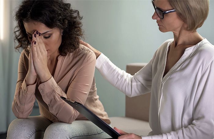 woman speaking with provider