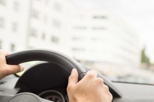 Image of a man driving a car